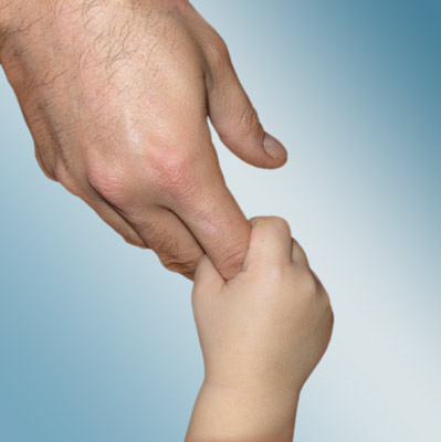 child's hand holding adult's fingers